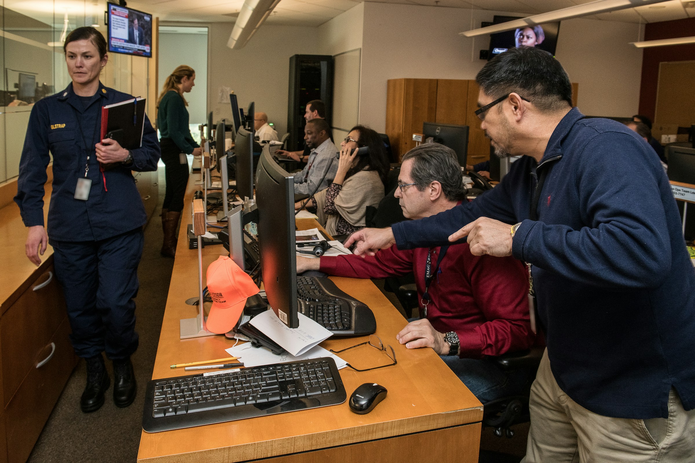 Operations center with radios and a responder at a console